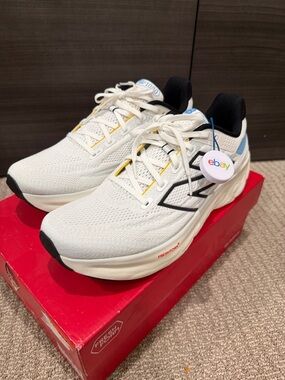 New Balance 1080v13 White Running Shoes with Black Logo and Blue Accents